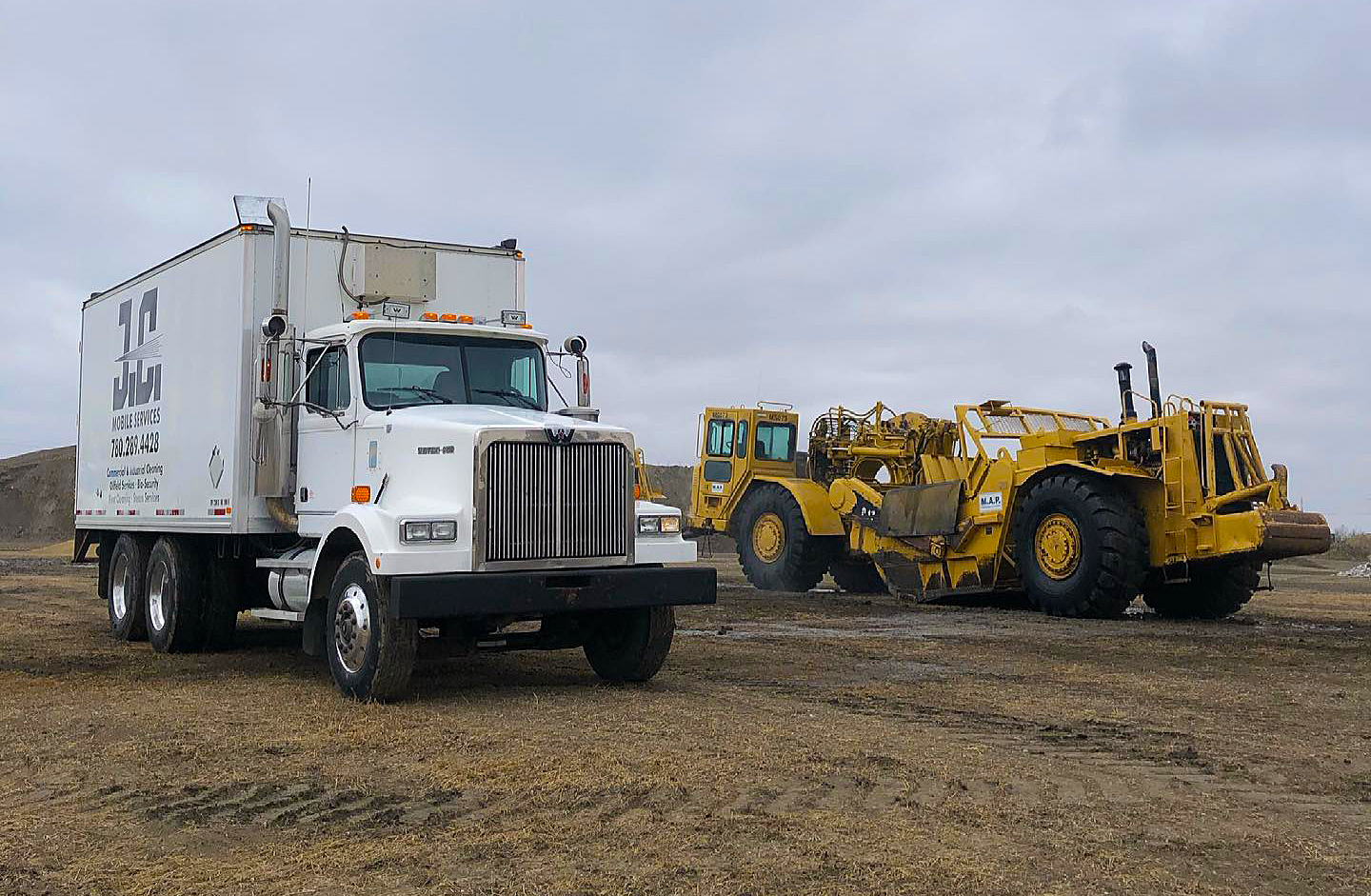 Power wash truck with large earthmover